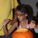 Sophia emptying her pumpkin