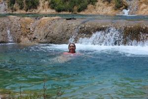 Swimming at the top of the falls